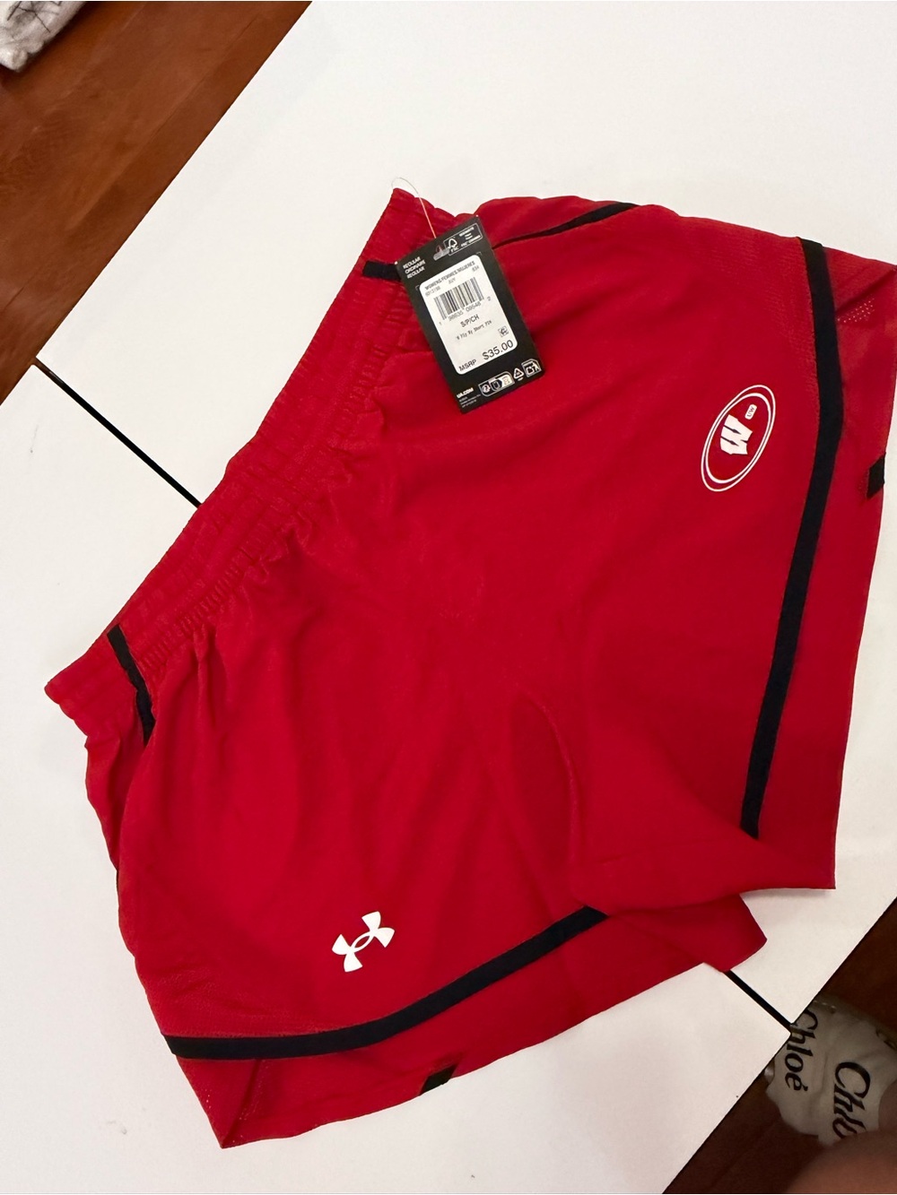 Under Armour women Red Athletic Shorts with Black Trim